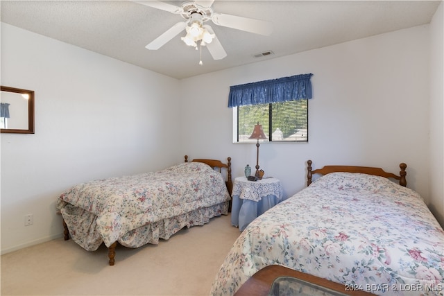 bedroom featuring carpet and ceiling fan