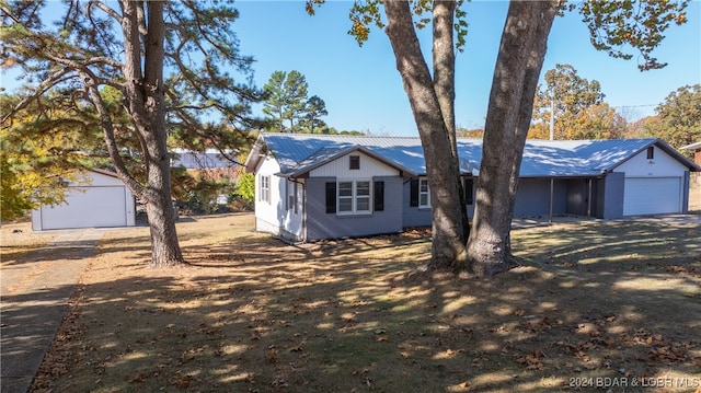 view of front of home with an outbuilding and a garage