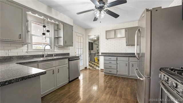 kitchen with gray cabinets, sink, stainless steel appliances, and dark hardwood / wood-style flooring