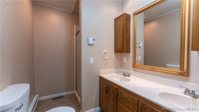 bathroom with vanity, toilet, and a baseboard radiator