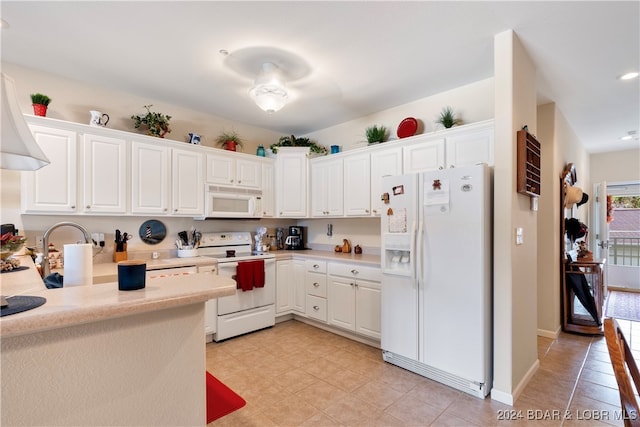 kitchen with white cabinets and white appliances