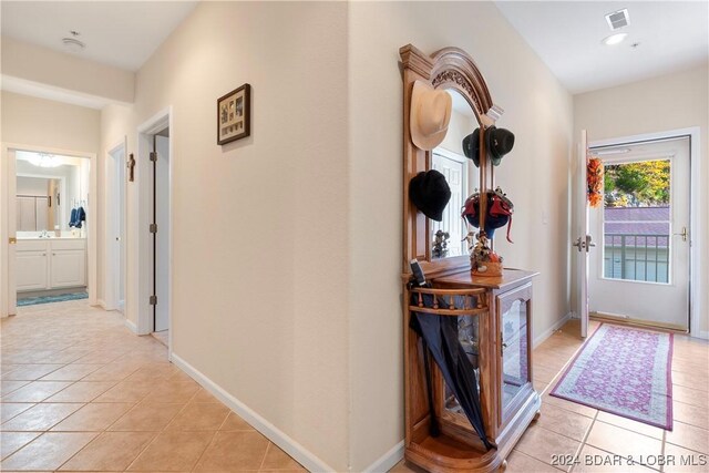 hallway with light tile patterned flooring