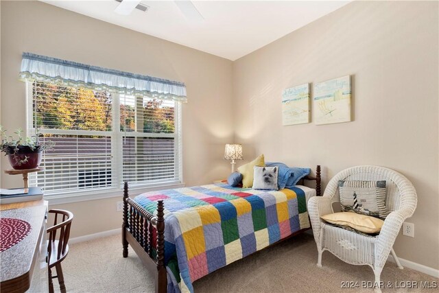 carpeted bedroom featuring ceiling fan