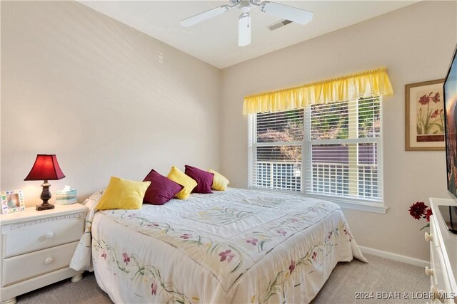 bedroom with light colored carpet and ceiling fan