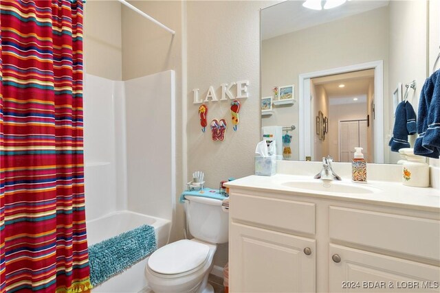 full bathroom with vanity, toilet, and shower / bath combo