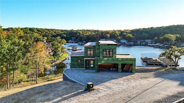 view of front of property with a water view