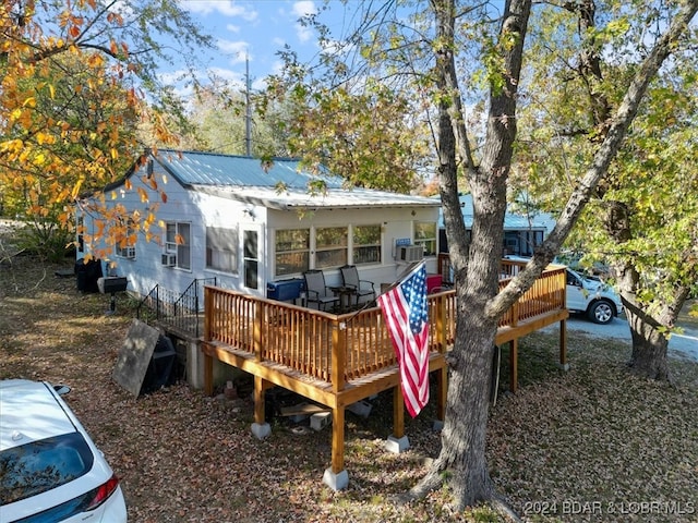 rear view of house with a deck