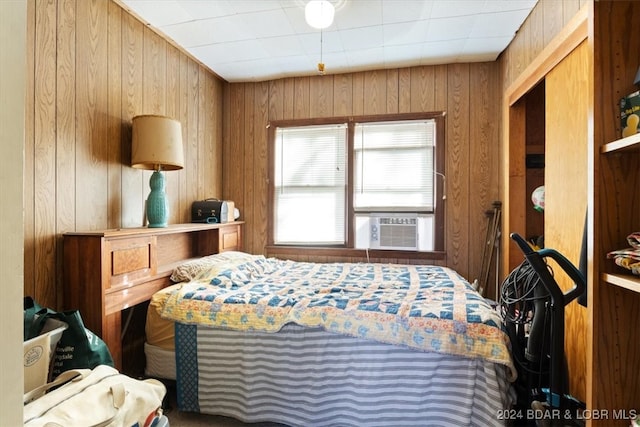 bedroom with wooden walls and cooling unit