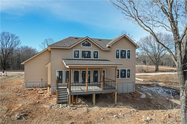 back of house featuring a sunroom