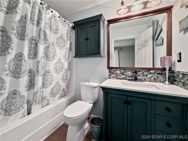 full bathroom featuring vanity, decorative backsplash, toilet, and shower / bath combination with curtain