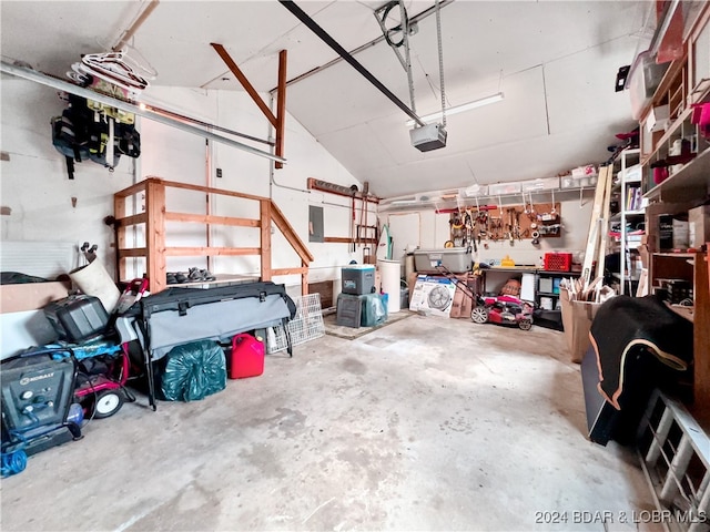 garage with a garage door opener and water heater