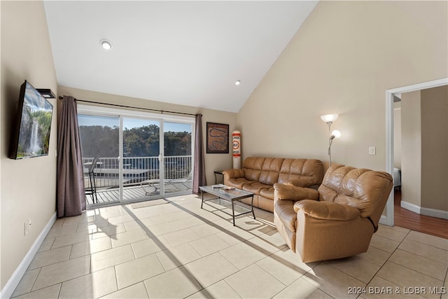 tiled living room with high vaulted ceiling