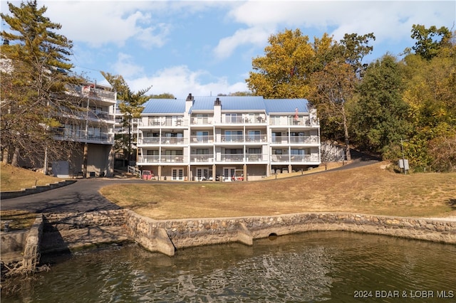 view of building exterior with a water view