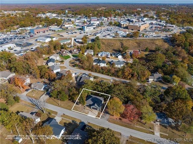 birds eye view of property with a residential view