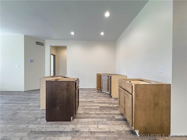 kitchen featuring light wood-style floors, recessed lighting, and a center island