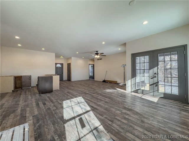 unfurnished living room with dark wood-style floors, recessed lighting, french doors, and a ceiling fan