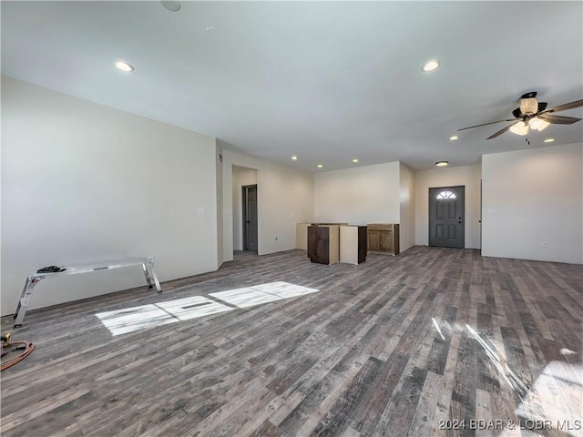 unfurnished living room featuring ceiling fan, wood finished floors, and recessed lighting