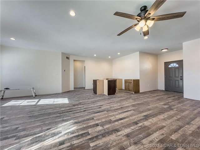 unfurnished living room featuring a ceiling fan, recessed lighting, and wood finished floors