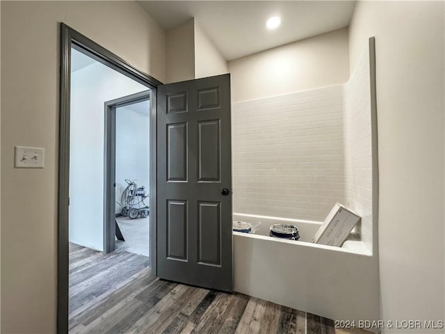 hallway featuring dark wood-style flooring