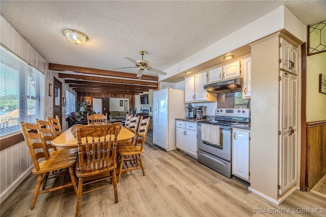 kitchen featuring under cabinet range hood, white refrigerator with ice dispenser, electric stove, light wood-type flooring, and dark countertops