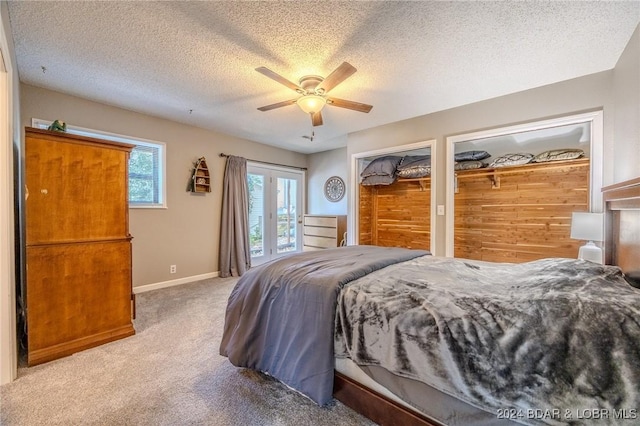 bedroom featuring carpet flooring, ceiling fan, a textured ceiling, and baseboards