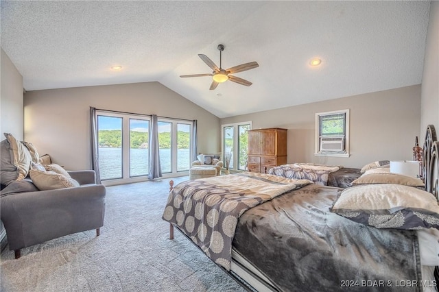 carpeted bedroom with access to outside, cooling unit, vaulted ceiling, ceiling fan, and a textured ceiling