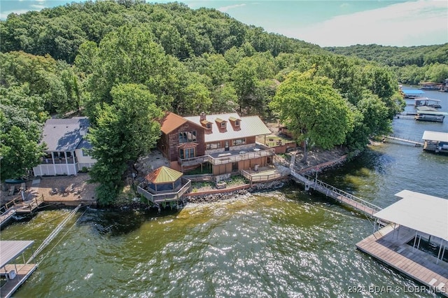 birds eye view of property featuring a water view