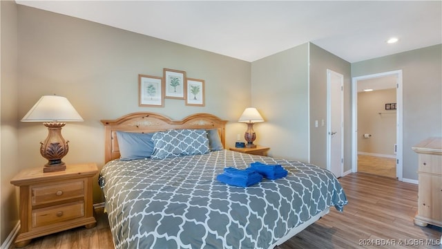 63 Elbow Cay Dr, Osage Beach, MO 65065 - bedroom featuring wood finished floors, baseboards, and recessed lighting