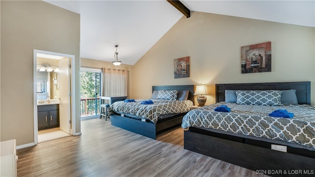 bedroom with ensuite bath, high vaulted ceiling, beamed ceiling, and hardwood / wood-style floors