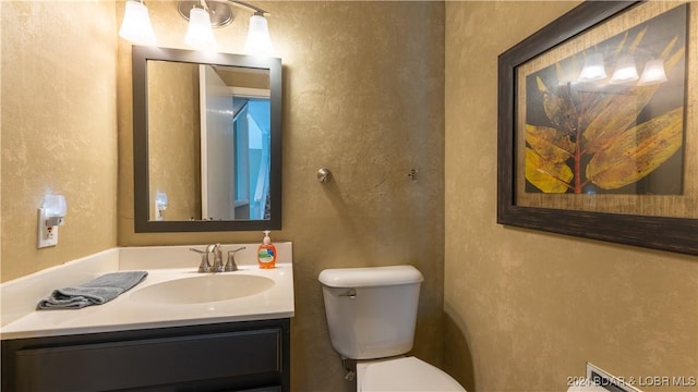 63 Elbow Cay Dr, Osage Beach, MO 65065 - bathroom with a textured wall, toilet, and vanity