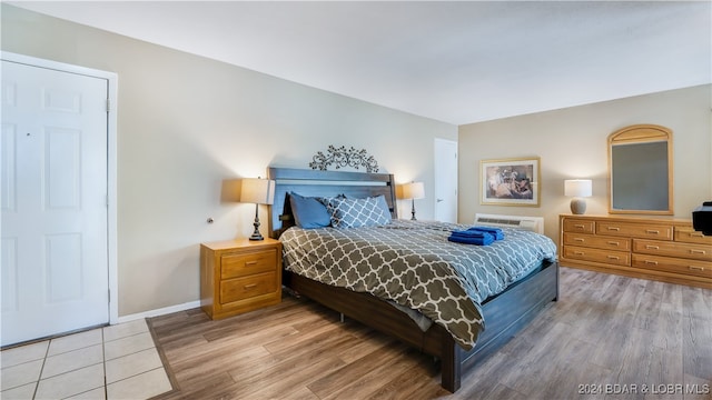 bedroom with light hardwood / wood-style flooring