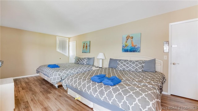 63 Elbow Cay Dr, Osage Beach, MO 65065 - bedroom featuring wood finished floors and baseboards