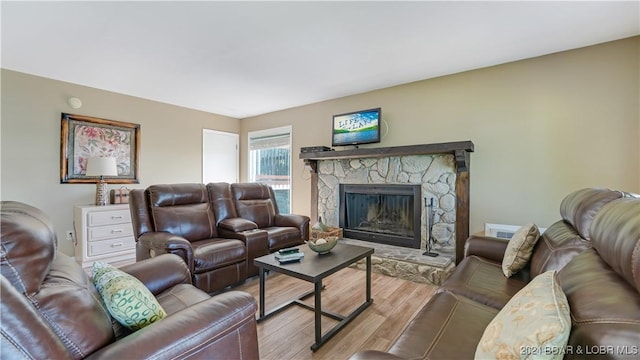 63 Elbow Cay Dr, Osage Beach, MO 65065 - living room with wood finished floors and a stone fireplace