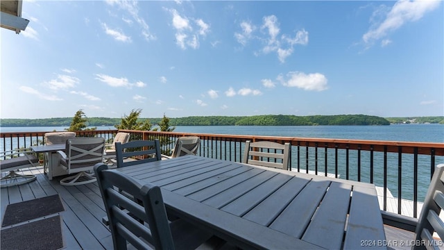 63 Elbow Cay Dr, Osage Beach, MO 65065 - wooden deck featuring outdoor dining space and a water view