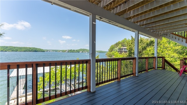 wooden terrace with a water view