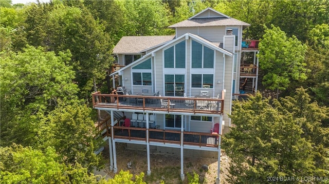 63 Elbow Cay Dr, Osage Beach, MO 65065 - back of property with a balcony and a forest view