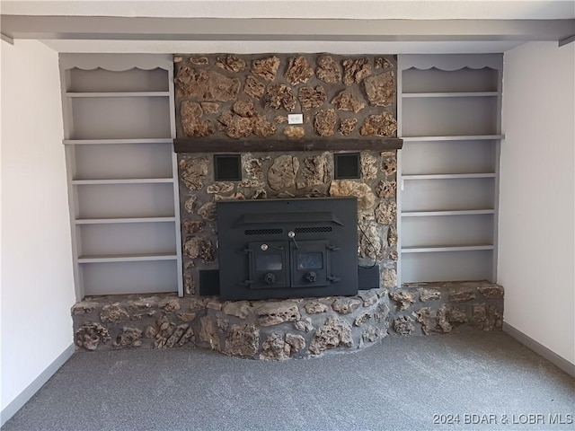 607 N Hughes Ave, Stover, MO 65078 - unfurnished living room featuring carpet, baseboards, and built in shelves