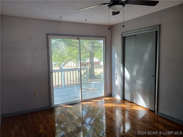 607 N Hughes Ave, Stover, MO 65078 - spare room with a ceiling fan, hardwood / wood-style flooring, and baseboards