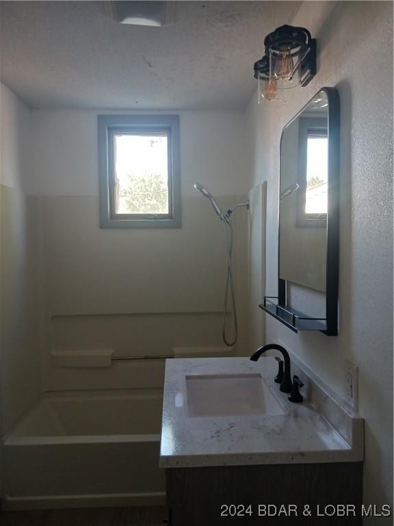 607 N Hughes Ave, Stover, MO 65078 - full bath featuring vanity and bathing tub / shower combination
