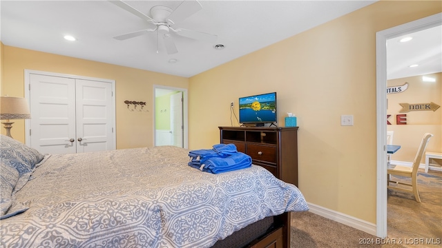 bedroom featuring carpet, a closet, and ceiling fan