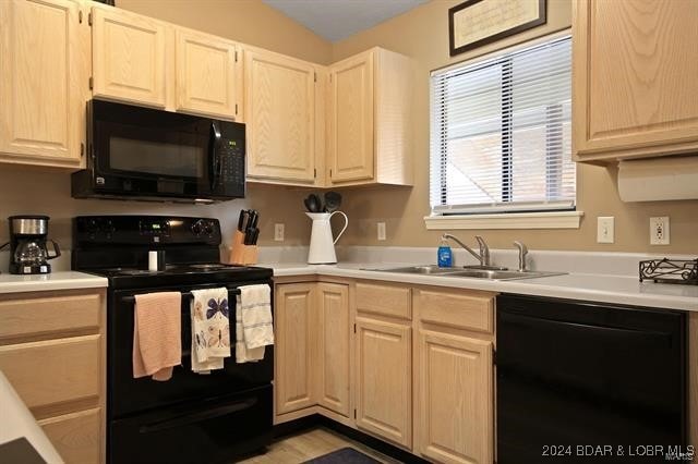 611 Lazy Days Rd Unit X11, Osage Beach, MO 65065 - kitchen featuring a sink, light countertops, and black appliances