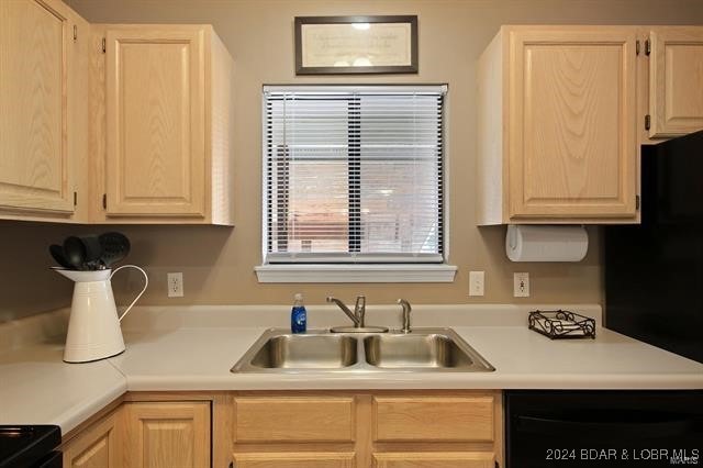 611 Lazy Days Rd Unit X11, Osage Beach, MO 65065 - kitchen featuring a sink, dishwashing machine, light brown cabinets, and light countertops