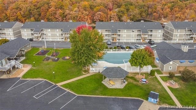 611 Lazy Days Rd Unit X11, Osage Beach, MO 65065 - bird's eye view featuring a forest view and a residential view