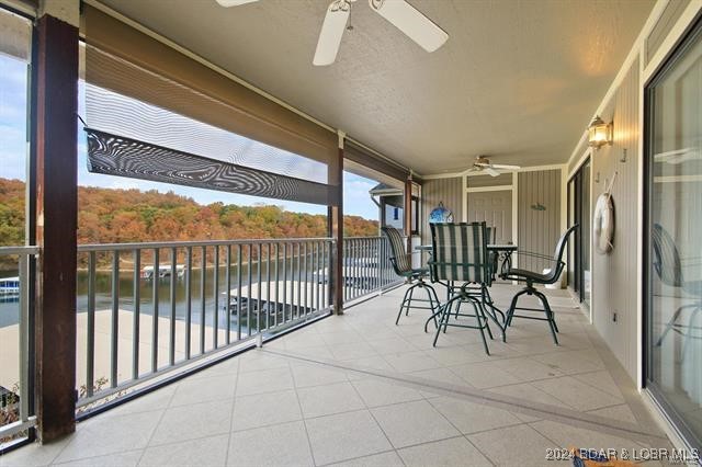 611 Lazy Days Rd Unit X11, Osage Beach, MO 65065 - balcony featuring a water view and ceiling fan