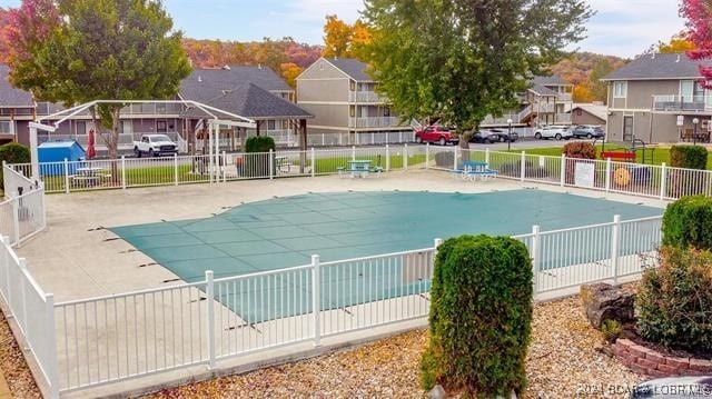 611 Lazy Days Rd Unit X11, Osage Beach, MO 65065 - community pool featuring a patio, fence, and a residential view