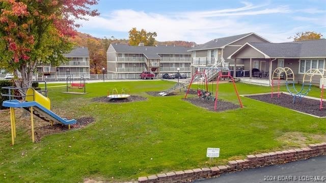 611 Lazy Days Rd Unit X11, Osage Beach, MO 65065 - view of home's community with a lawn