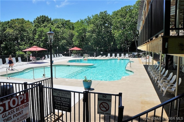 view of swimming pool featuring a patio area