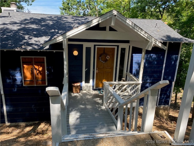 entrance to property with a porch