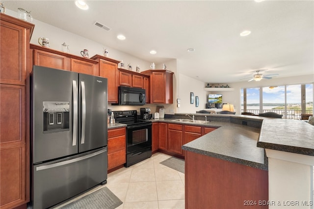 kitchen with ceiling fan, sink, kitchen peninsula, light tile patterned flooring, and black appliances