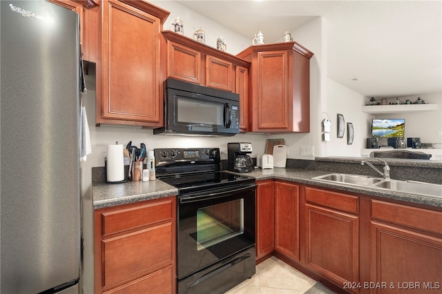 kitchen with light tile patterned floors, sink, and black appliances